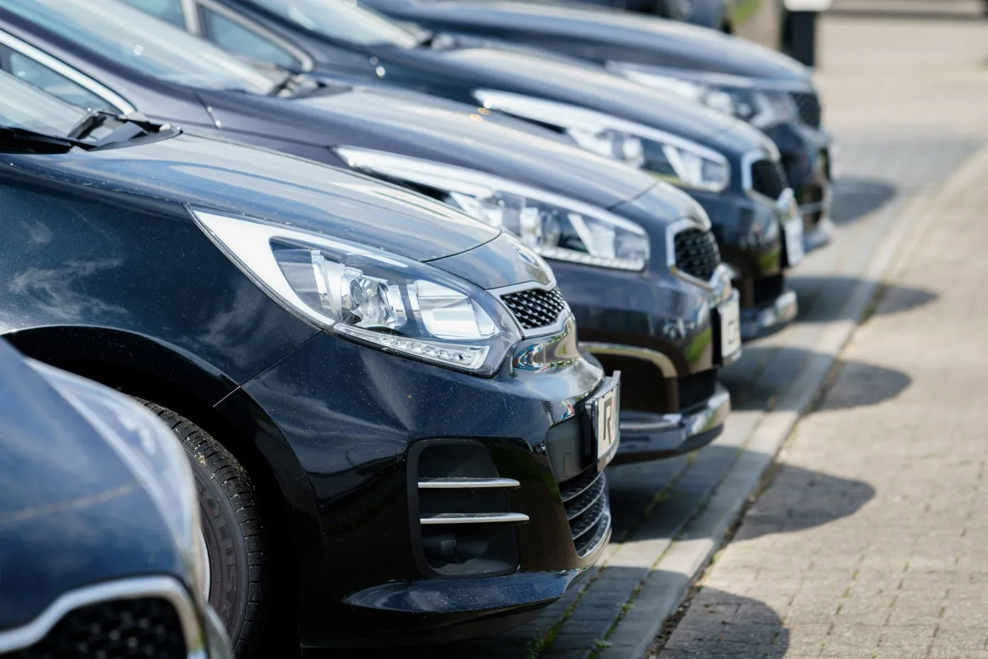Fleet of cars parked in a line